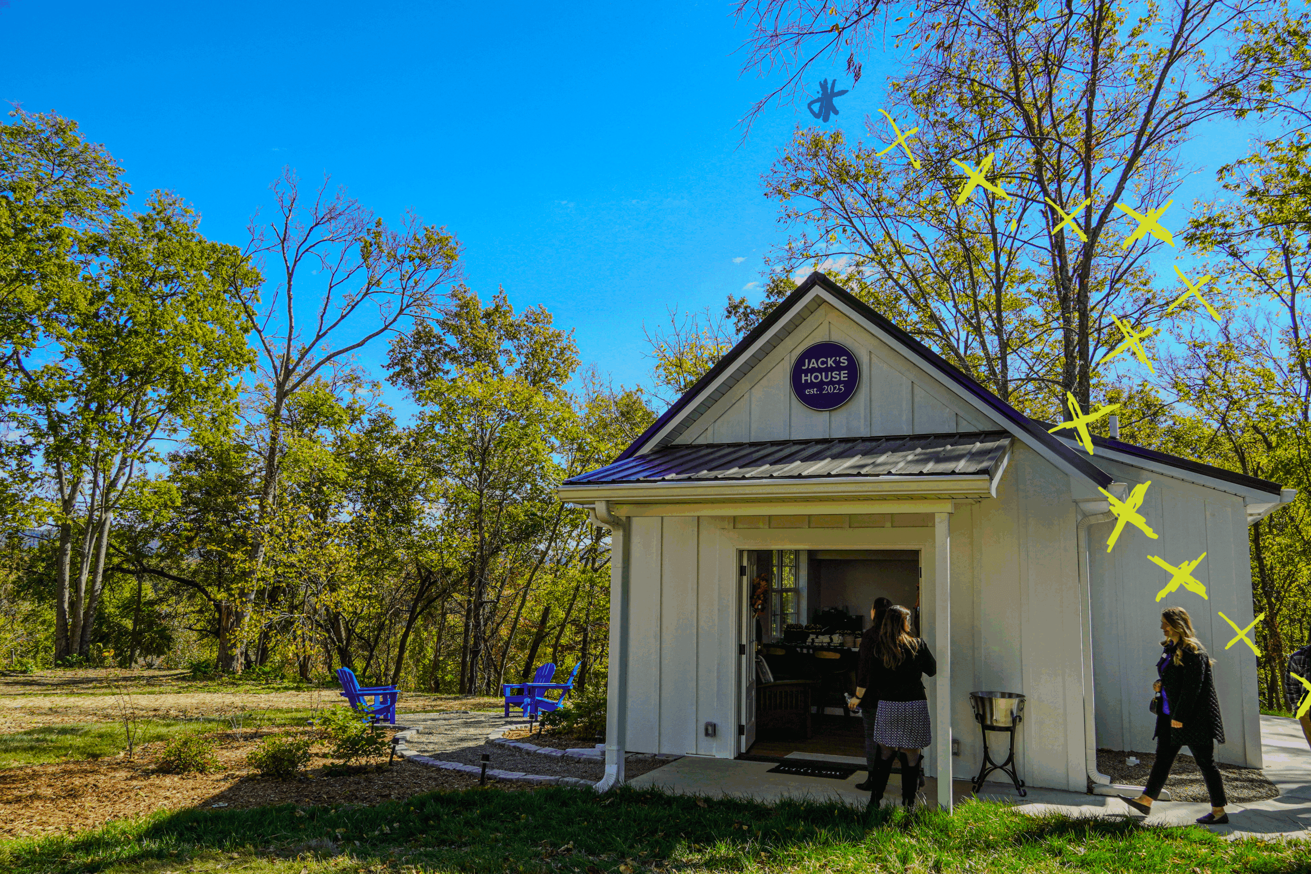 The front of Jack's House in the fall with the front doors open.